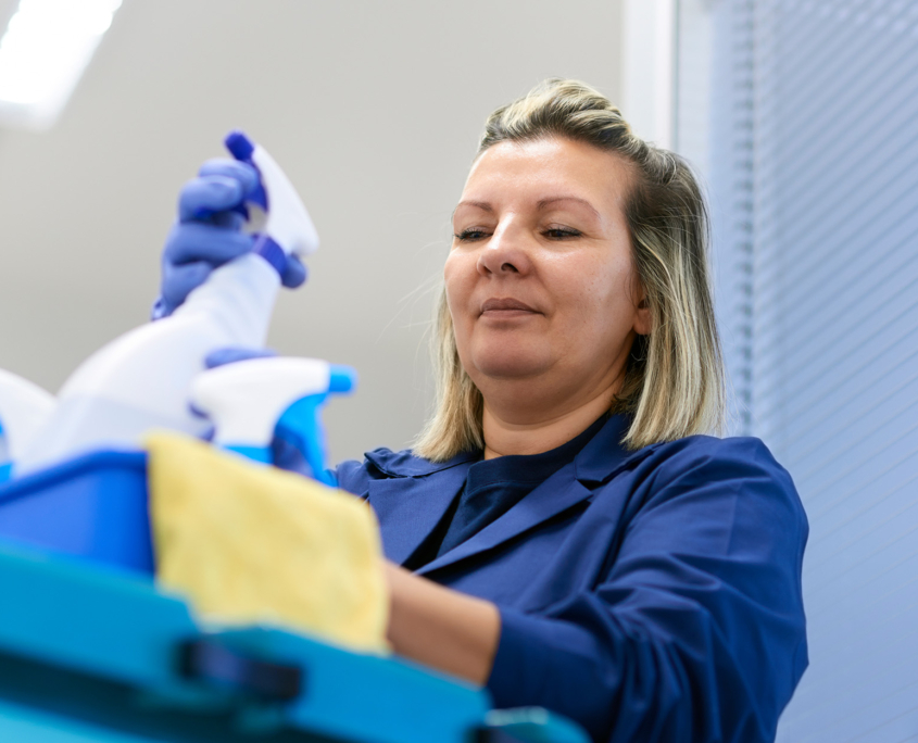 Woman Working As Professional Cleaner In Office